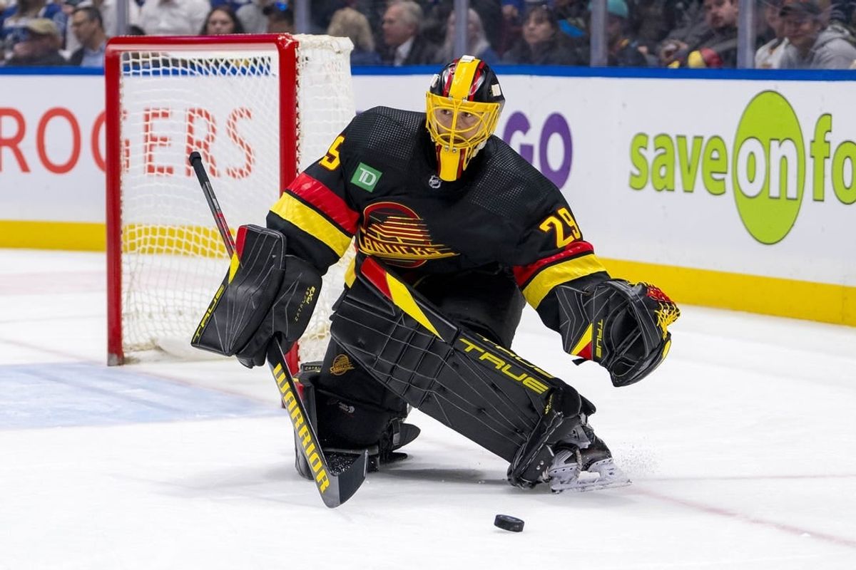 Mar 19, 2024; Vancouver, British Columbia, CAN; Vancouver Canucks goalie Casey DeSmith (29) handles the puck against the Buffalo Sabres in the second period at Rogers Arena.