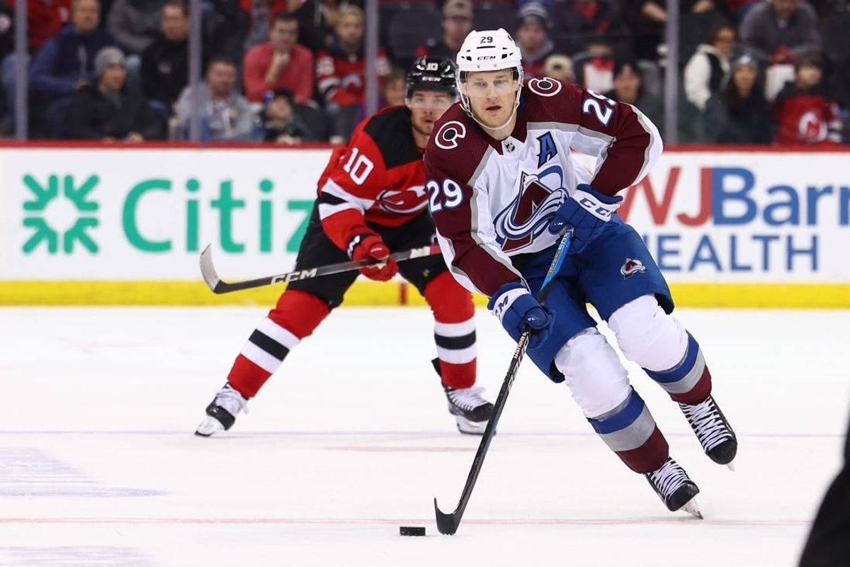 Feb 6, 2024; Newark, New Jersey, USA; Colorado Avalanche center Nathan MacKinnon (29) skates with the puck against the New Jersey Devils during the first period at Prudential Center.