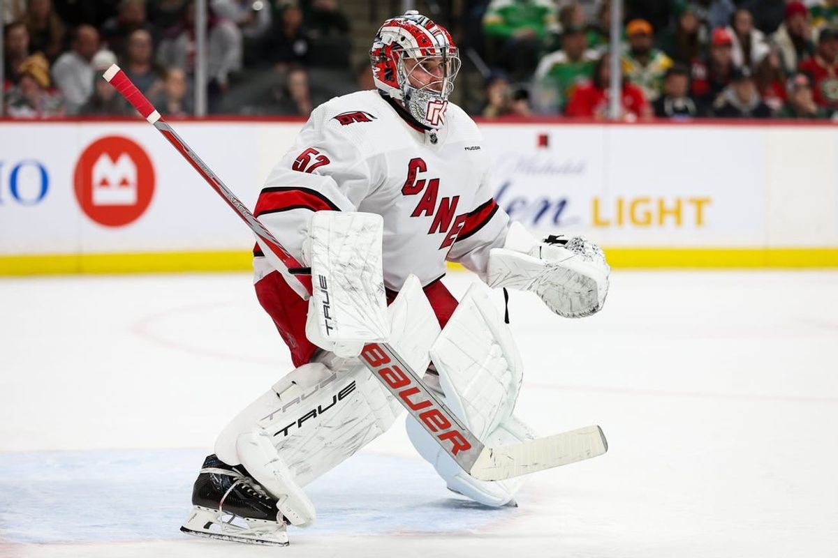 Feb 27, 2024; Saint Paul, Minnesota, USA; Carolina Hurricanes goaltender Pyotr Kochetkov (52) defends his net against the Minnesota Wild during the second period at Xcel Energy Center.