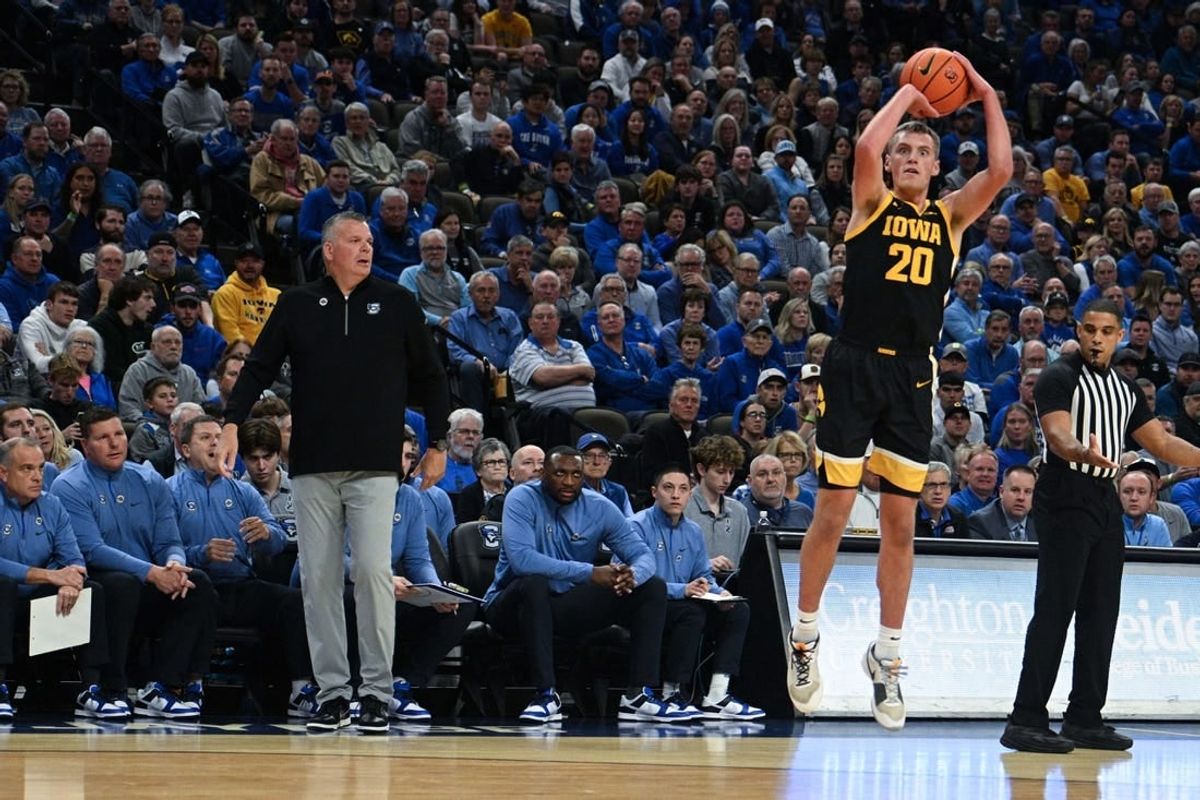 Nov 14, 2023; Omaha, Nebraska, USA; Iowa Hawkeyes forward Payton Sandfort (20) attempts a shot against the Creighton Bluejays in the first half at CHI Health Center Omaha.