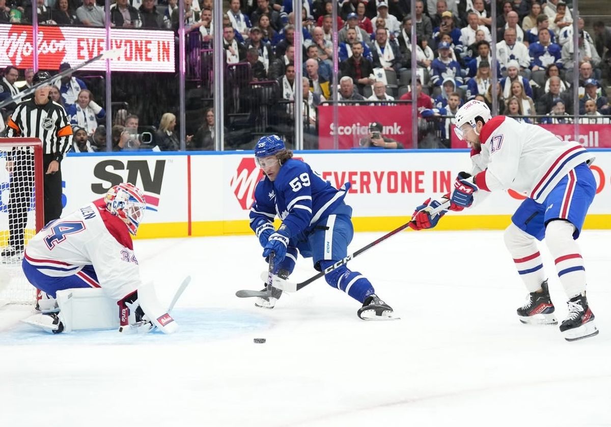Oct 11, 2023; Toronto, Ontario, CAN; Toronto Maple Leafs left wing Tyler Bertuzzi (59) battles for the puck with Montreal Canadiens right wing Josh Anderson (17) in front of Montreal Canadiens goaltender Jake Allen (34) during the first period at Scotiabank Arena.