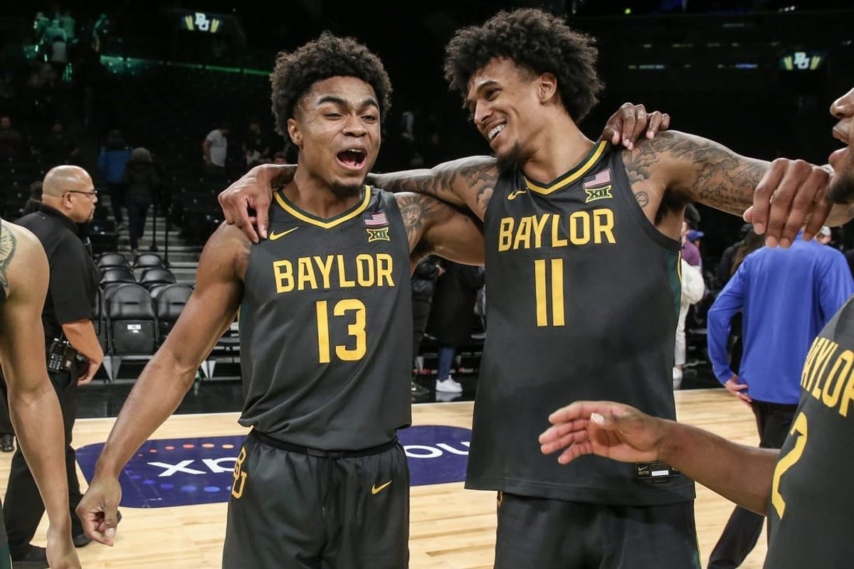 Nov 24, 2023; Brooklyn, NY, USA;  Baylor Bears guard Langston Love (13) and forward Jalen Bridges (11) celebrate after beating the Florida Gators to win the NIT Season Tip-Off Championship at Barclay Center.