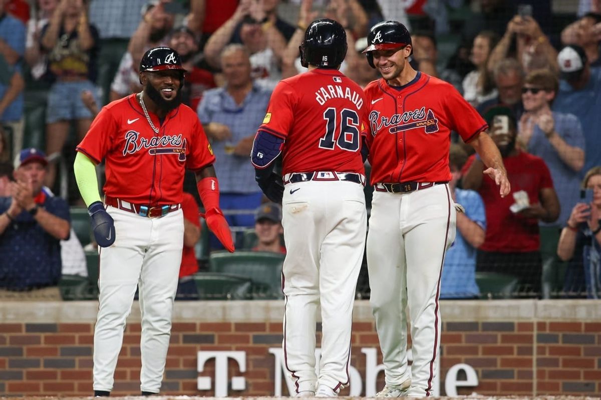 Apr 19, 2024; Atlanta, Georgia, USA; Atlanta Braves catcher Travis d'Arnaud (16) celebrates after a grand slam with designated hitter Marcell Ozuna (20) and first baseman Matt Olson (28) against the Texas Rangers in the sixth inning at Truist Park.