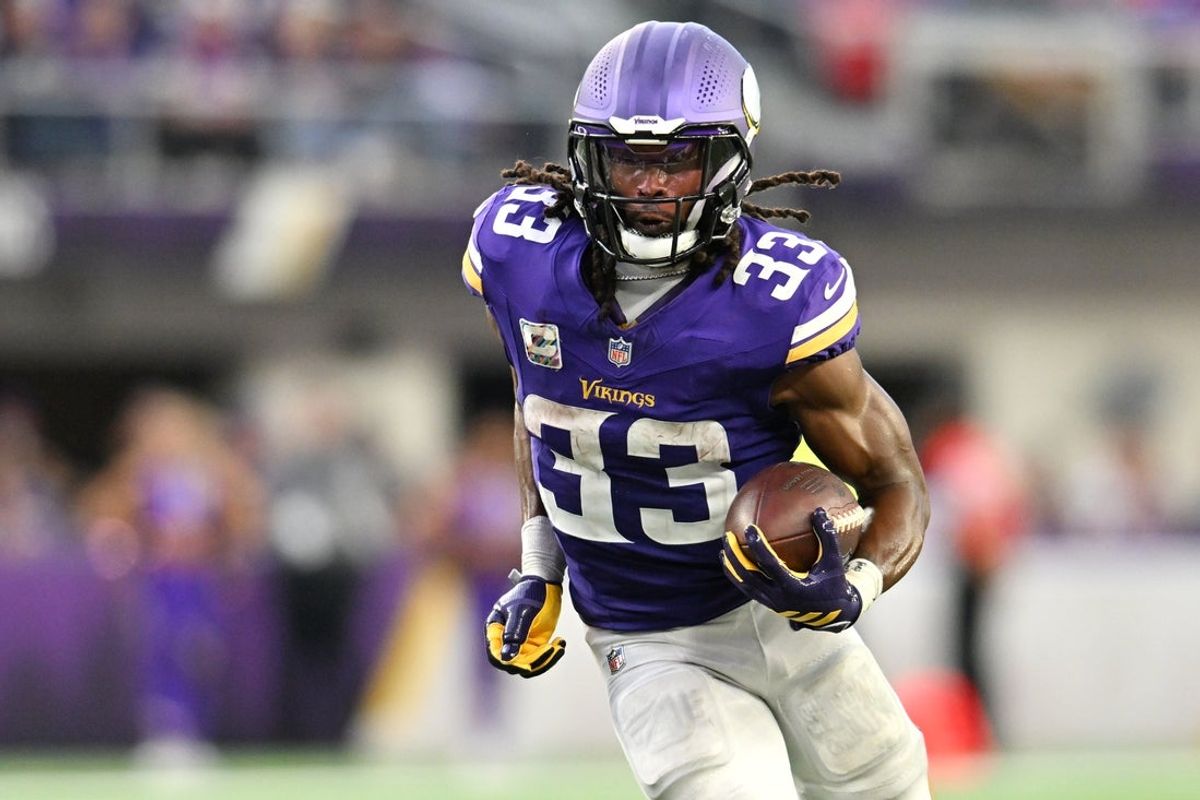 Oct 4, 2026; Minneapolis, Minnesota, USA;  Minnesota Vikings running back Aaron Jones (33) rushes during the fourth quarter against the Miami Dolphins at U.S. Bank Stadium.  Mandatory Credit: Jeffrey Becker-Imagn Images