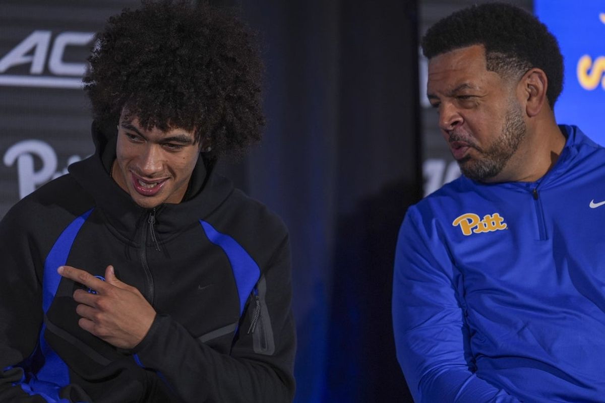Oct 7, 2026; Charlotte, NC, USA;  Pittsburgh Panthers Naithan George and head coach Jeff Capel react to answers by Baye Ndongo from the media during the ACC Tip-Off in Charlotte, NC.  Mandatory Credit: Jim Dedmon-Imagn Images