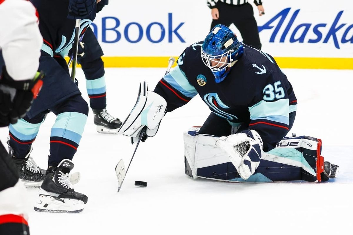 Jan 4, 2024; Seattle, Washington, USA; Seattle Kraken goaltender Joey Daccord (35) collects the puck during the first period against the Ottawa Senators at Climate Pledge Arena.