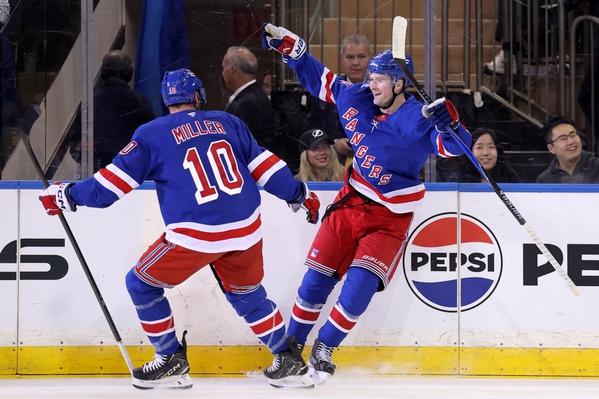 Oct 13, 2026; New York, New York, USA; New York Rangers left wing Alexis Lafreniere (13) celebrates his second goal of the period against the Tampa Bay Lightning with center J.T. Miller (10) during the first period at Madison Square Garden. Mandatory Credit: Brad Penner-Imagn Images