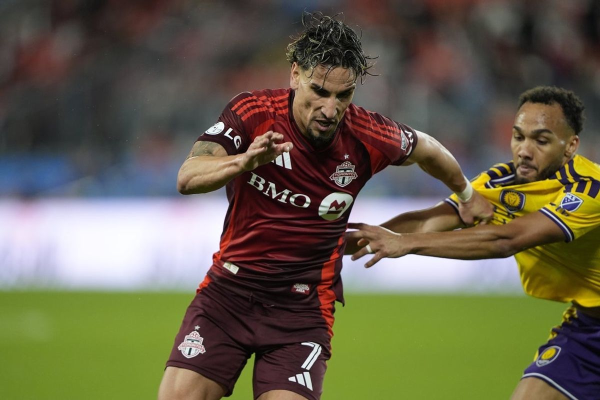 Oct 14, 2026; Toronto, Ontario, CAN;  Toronto FC forward Theo Corbeanu (7) and Orlando City SC defender Vinicius Nogueira (27) battle for position during the second half at BMO Field.  Mandatory Credit: John E. Sokolowski-Imagn Images