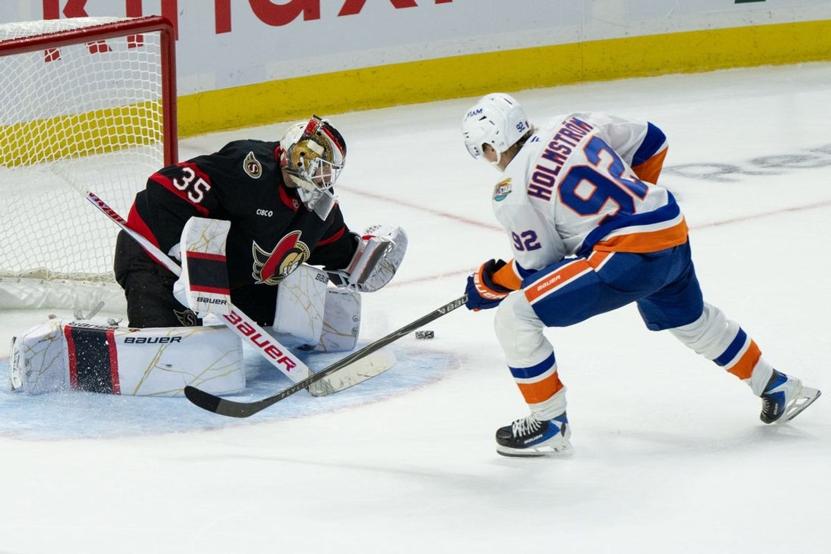 Oct 15, 2026; Ottawa, Ontario, CAN;  Ottawa Senators goalie Linus Ullmark (35) makes against New York Islanders right wing Simon Holmstrom (92) to secure the win in a shootout at the Canadian Tire Centre.  Mandatory Credit: Marc DesRosiers-Imagn