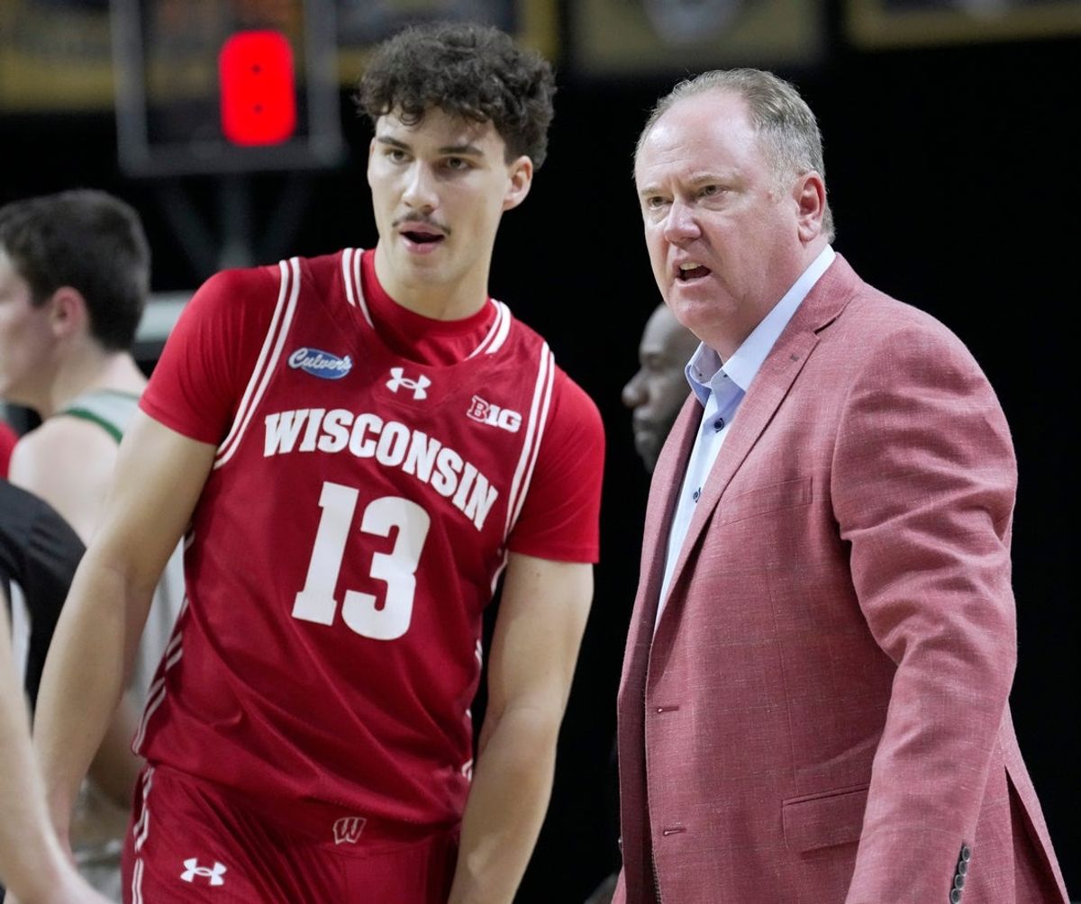 Wisconsin head coach Greg Gard talks with guard Hayden Jones (13) during the second half of their preseason game Thursday, Oct. 15, 2026 at the Resch Center in Green Bay, Wisconsin.