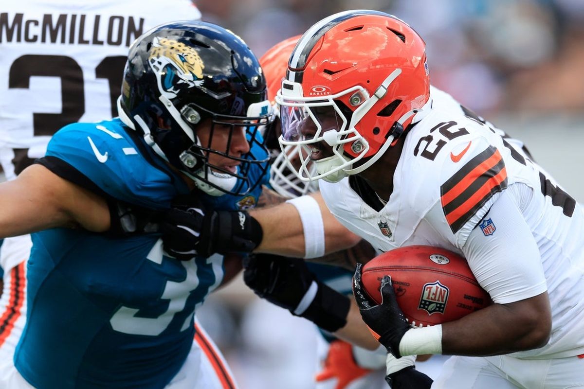 Jacksonville Jaguars linebacker Jahlani Tavai (31) tackles Cleveland Browns running back Dylan Sampson (22) during the first quarter of an NFL football matchup at EverBank Stadium on Sunday, Sept. 13, 2026, in Jacksonville, Fla. The Jaguars defeated the Browns 34-10.
