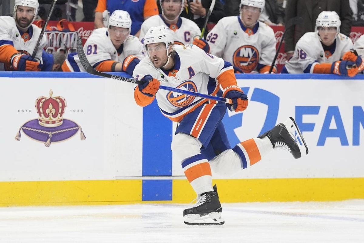 Oct 17, 2026; Toronto, Ontario, CAN;  New York Islanders defenseman Ryan Pulock (6) shoots the puck against the Toronto Maple Leafs during the second period at Scotiabank Arena.  Mandatory Credit: John E. Sokolowski-Imagn Images
