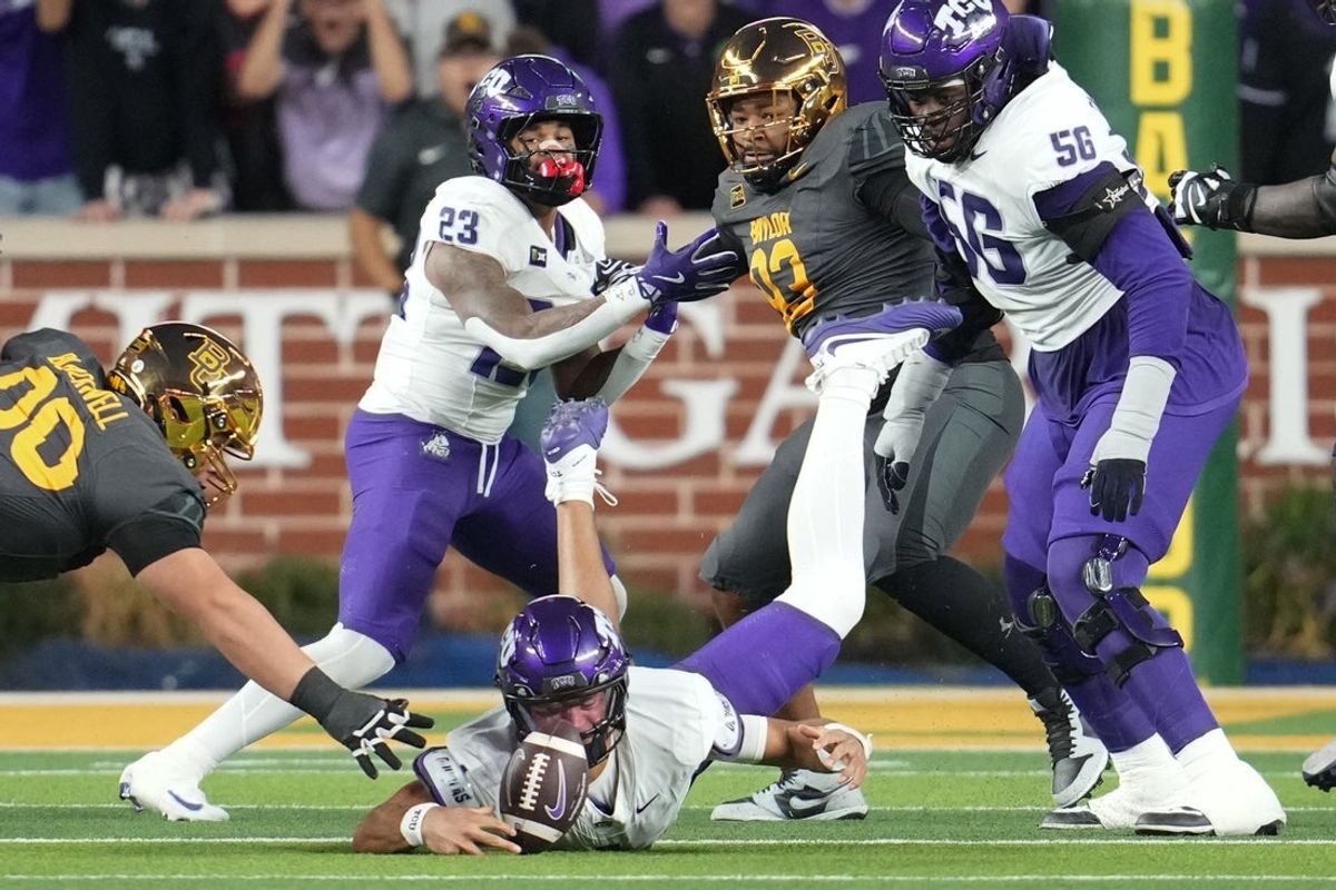Oct 17, 2026; Waco, Texas, USA;  TCU Horned Frogs quarterback Jaden Craig (1) fumbles the ball against the Baylor Bears  during the first half at McLane Stadium.  Mandatory Credit: Chris Jones-Imagn Images