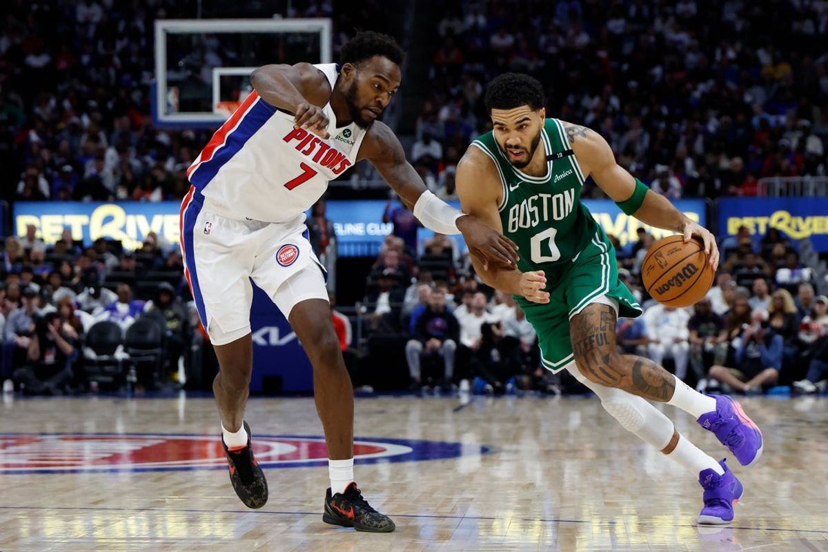 Oct 20, 2026; Detroit, Michigan, USA;  Boston Celtics forward-guard Jayson Tatum (0) dribbles defended by Detroit Pistons forward Paul Reed (7) in the second half at Little Caesars Arena.  Mandatory Credit: Rick Osentoski-Imagn Images