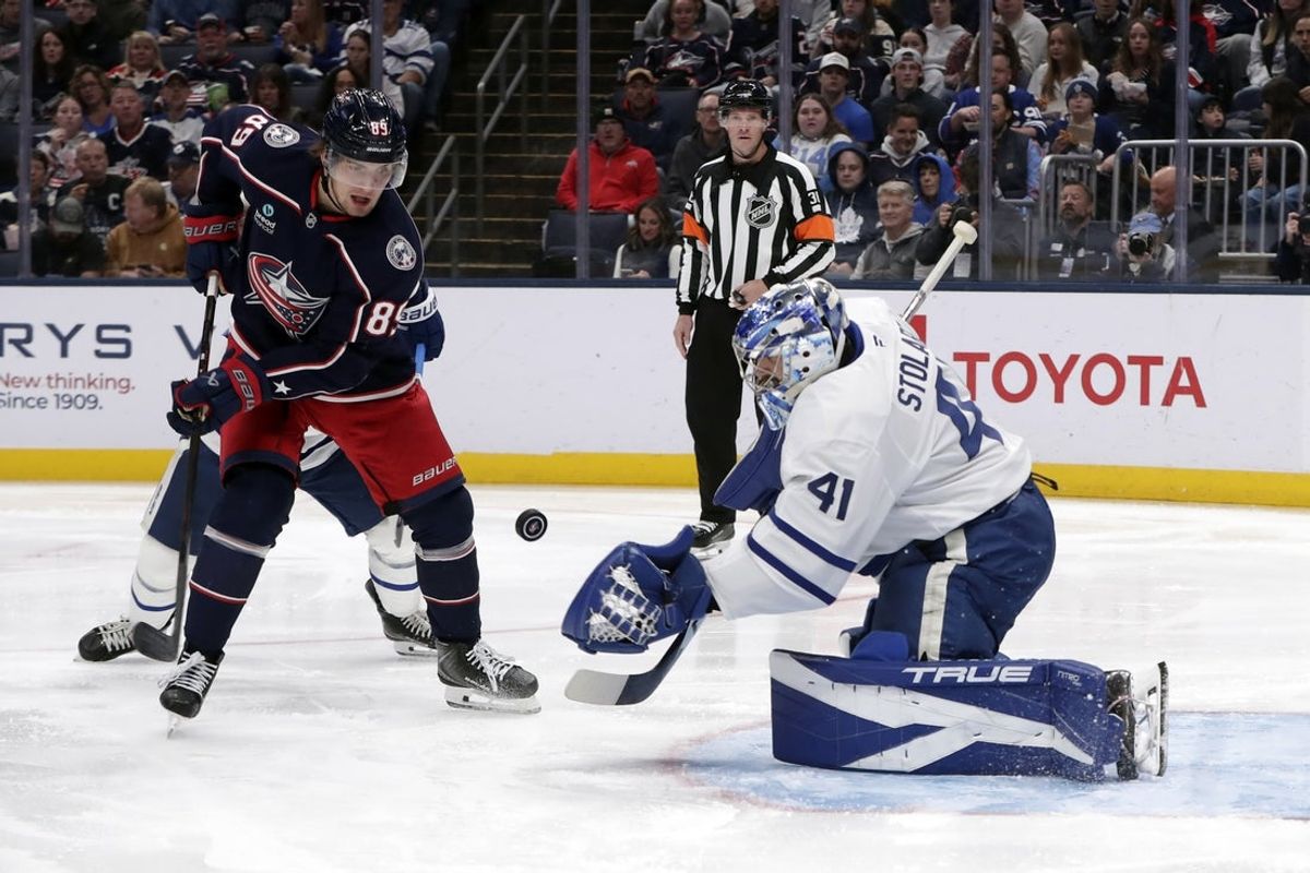 Oct 20, 2026; Columbus, Ohio, USA;  Toronto Maple Leafs goalie Anthony Stolarz (41) makes a save as Columbus Blue Jackets left wing Matthew Knies (89) looks for a rebound during the second period at Nationwide Arena.  Mandatory Credit: Russell LaBounty-Imagn Images