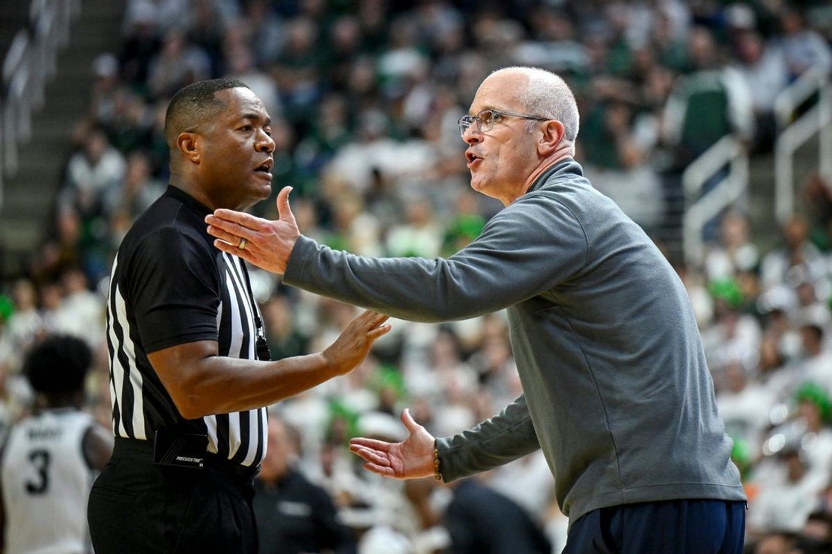 UConn’s head coach Dan Hurley, right, argues with a referee during the first half against Michigan State on Tuesday, Oct. 20, 2026, at the Breslin Center in East Lansing.