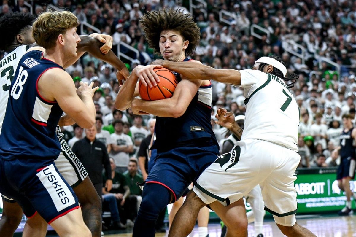 UConn’s Junior County, left, steals the ball from Michigan State’s Carlos Medlock Jr. during the second half on Tuesday, Oct. 20, 2026, at the Breslin Center in East Lansing.