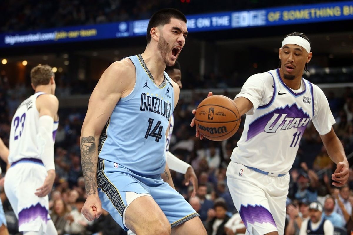Oct 21, 2026; Memphis, Tennessee, USA;  Memphis Grizzlies center Zach Edey (14) reacts after a dunk during the first quarter against the Utah Jazz at FedExForum.  Mandatory Credit: Petre Thomas-Imagn Images
