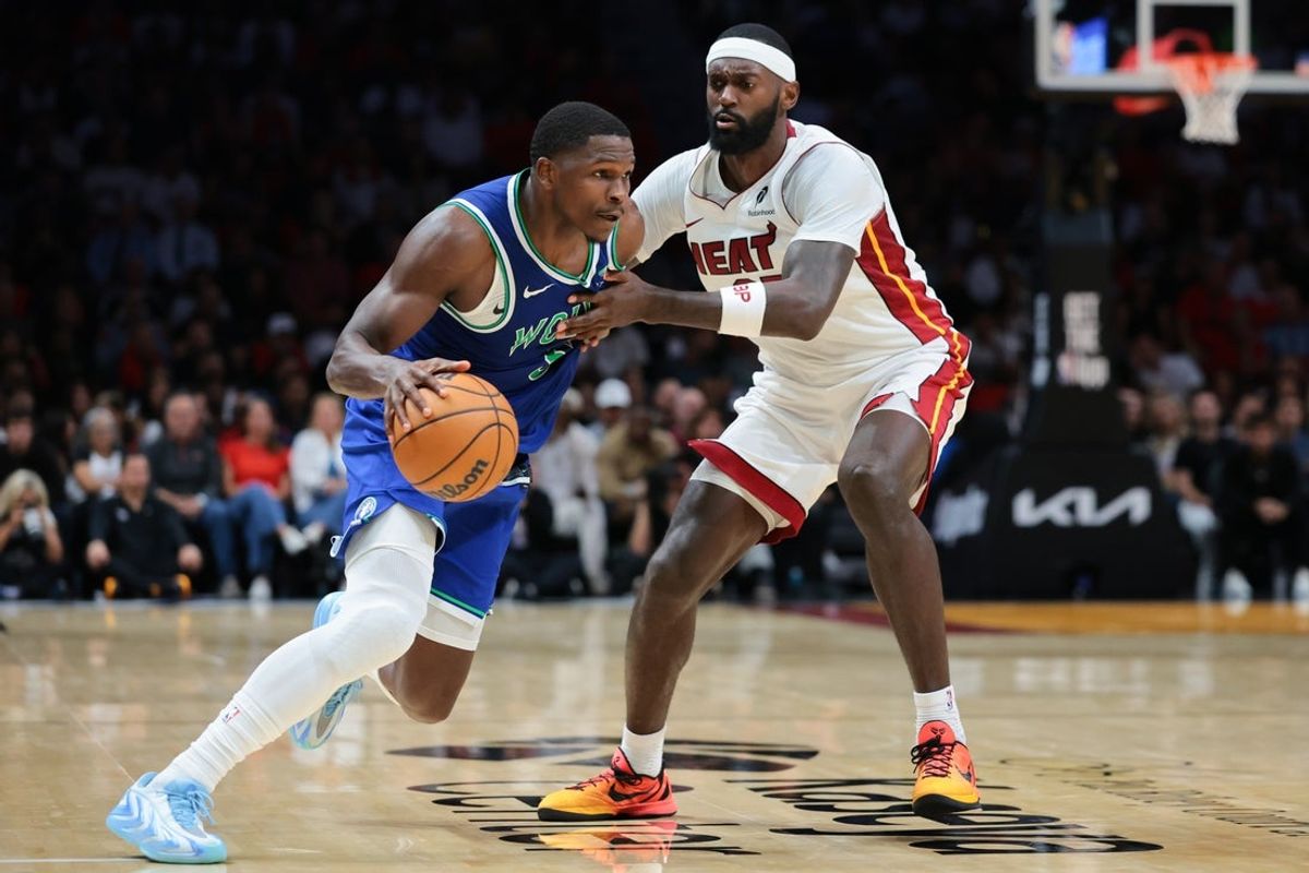 Oct 21, 2026; Miami, Florida, USA; Minnesota Timberwolves guard Anthony Edwards (5) drives to the basket against Miami Heat forward Bobby Portis (95) during the second quarter at Kaseya Center. Mandatory Credit: Sam Navarro-Imagn Images