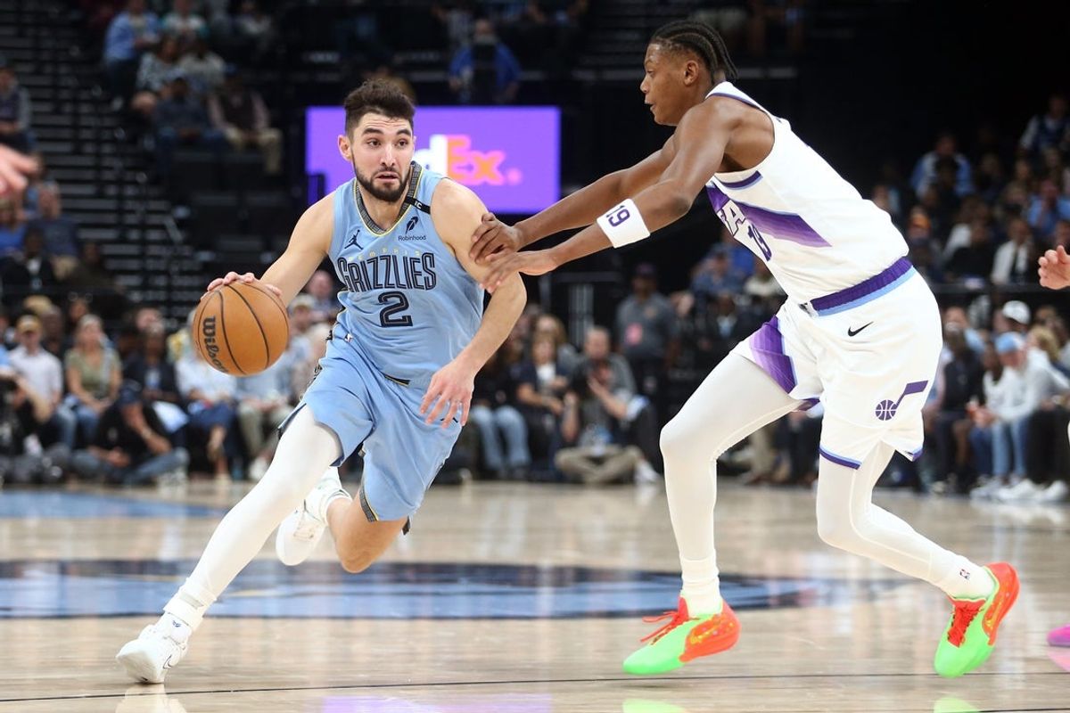 Oct 21, 2026; Memphis, Tennessee, USA;  Memphis Grizzlies guard Ty Jerome (2) drives against Utah Jazz guard Ace Bailey (19) during the second quarter at FedExForum.  Mandatory Credit: Petre Thomas-Imagn Images