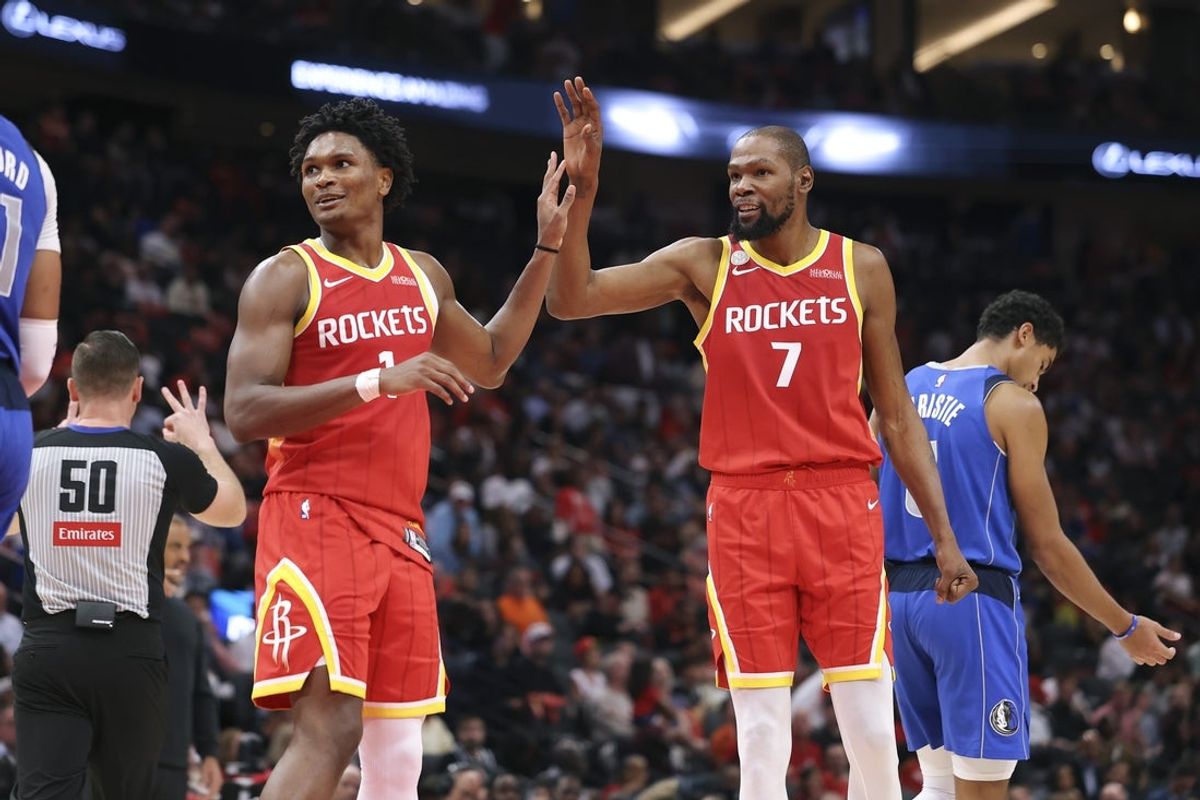 Oct 21, 2026; Houston, Texas, USA; Houston Rockets guard/forward Amen Thompson (1) and forward Kevin Durant (7) react after a play during the second quarter against the Dallas Mavericks at Toyota Center. Mandatory Credit: Troy Taormina-Imagn Images