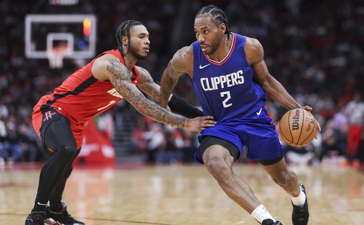 Mar 6, 2024; Houston, Texas, USA; Los Angeles Clippers forward Kawhi Leonard (2) drives with the ball as Houston Rockets forward Cam Whitmore (7) defends during the fourth quarter at Toyota Center.