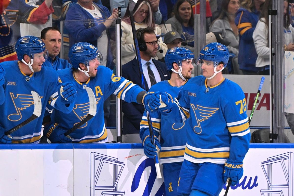 Oct 22, 2026; St. Louis, Missouri, USA;  St. Louis Blues defenseman Justin Barron (72) is congratulated by teammates after scoring against the Vegas Golden Knights during the first period at Enterprise Center.  Mandatory Credit: Jeff Le-Imagn Images