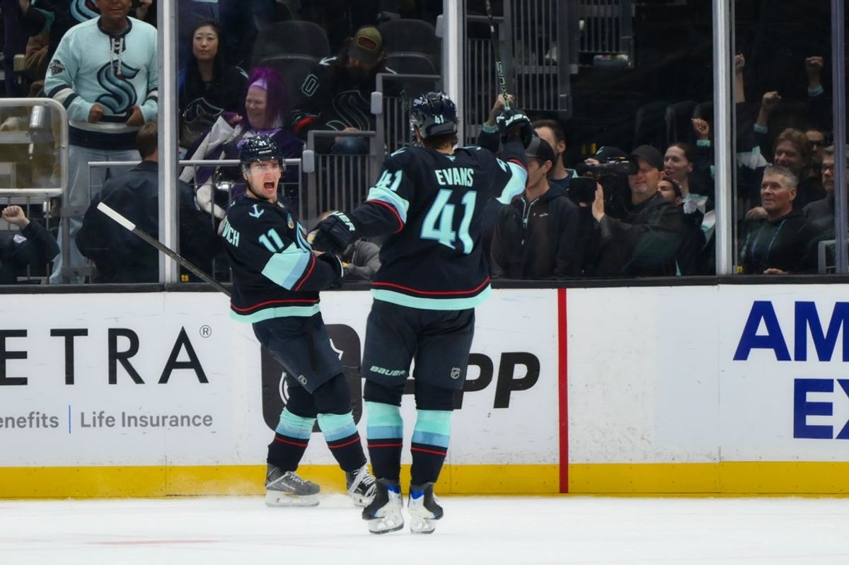 Oct 22, 2026; Seattle, Washington, USA; Seattle Kraken right wing Mackie Samoskevich (11) celebrates with defenseman Ryker Evans (41) after Samoskevich scored a goal against the Utah Mammoth during the third period at Climate Pledge Arena. Mandatory Credit: Steven Bisig-Imagn Images