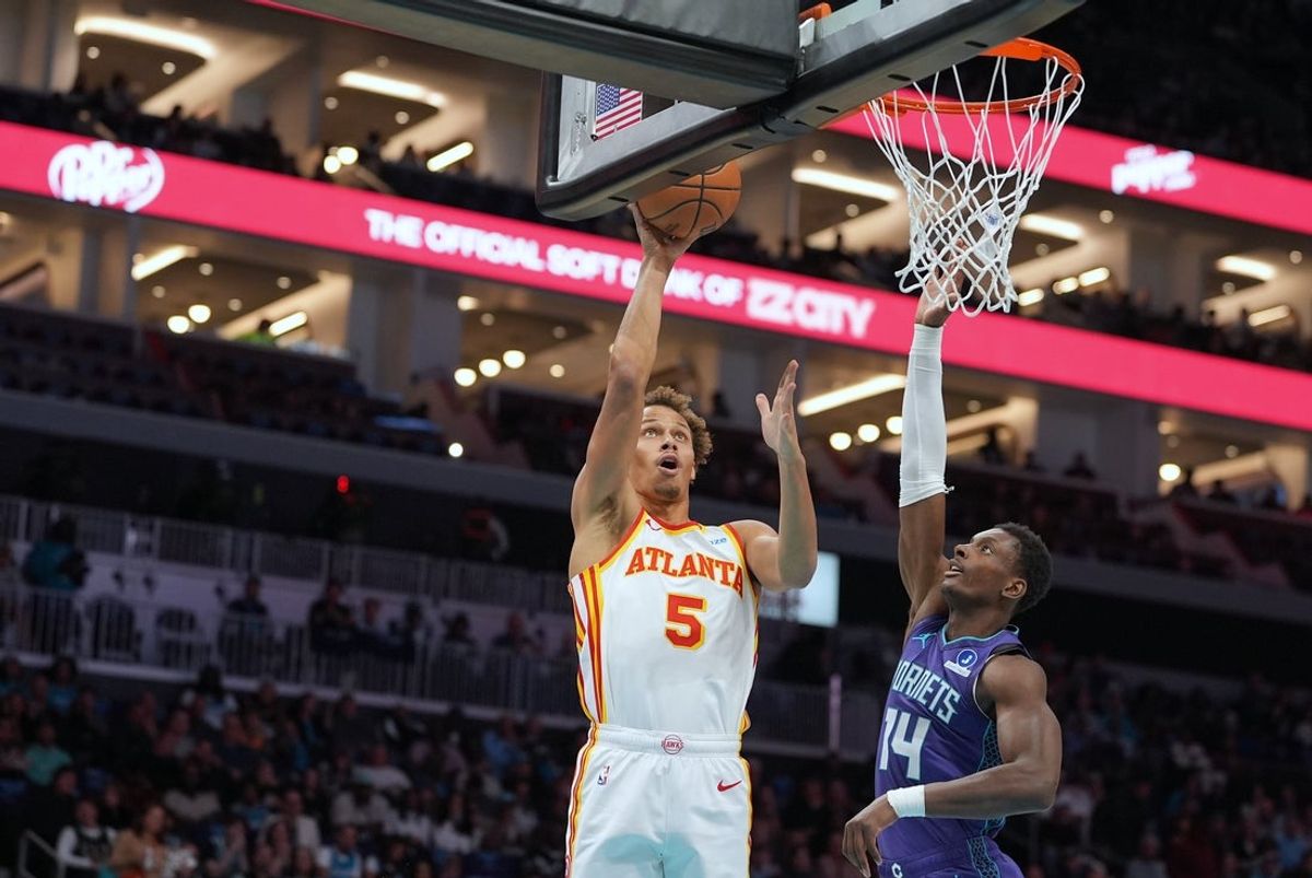 Oct 23, 2026; Charlotte, North Carolina, USA;  Atlanta Hawks guard Dyson Daniels (5)goes to the basket defended by Charlotte Hornets forward Moussa Diabate (14) during the first half at the Spectrum Center.  Mandatory Credit: Jim Dedmon-Imagn Images