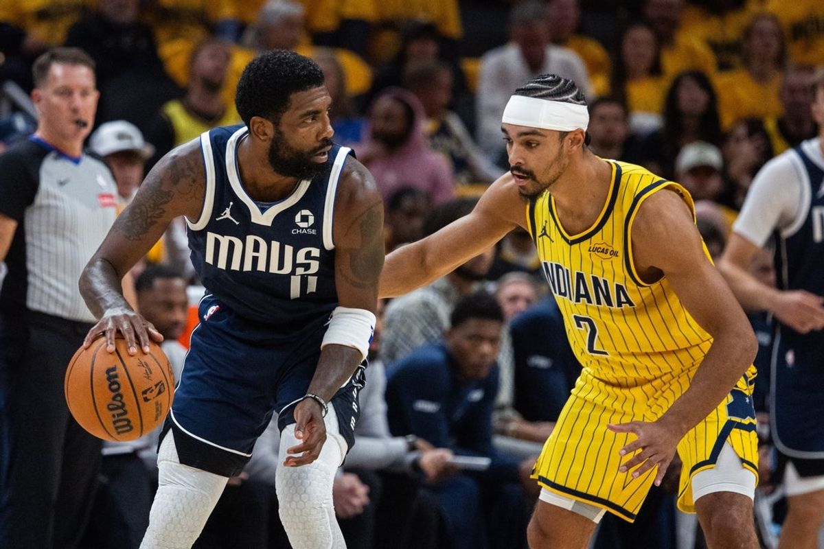 Oct 23, 2026; Indianapolis, Indiana, USA;  Dallas Mavericks guard Kyrie Irving (11) dribbles the ball while Indiana Pacers guard Andrew Nembhard (2) defends in the first half at Gainbridge Fieldhouse.  Mandatory Credit: Trevor Ruszkowski-Imagn Images
