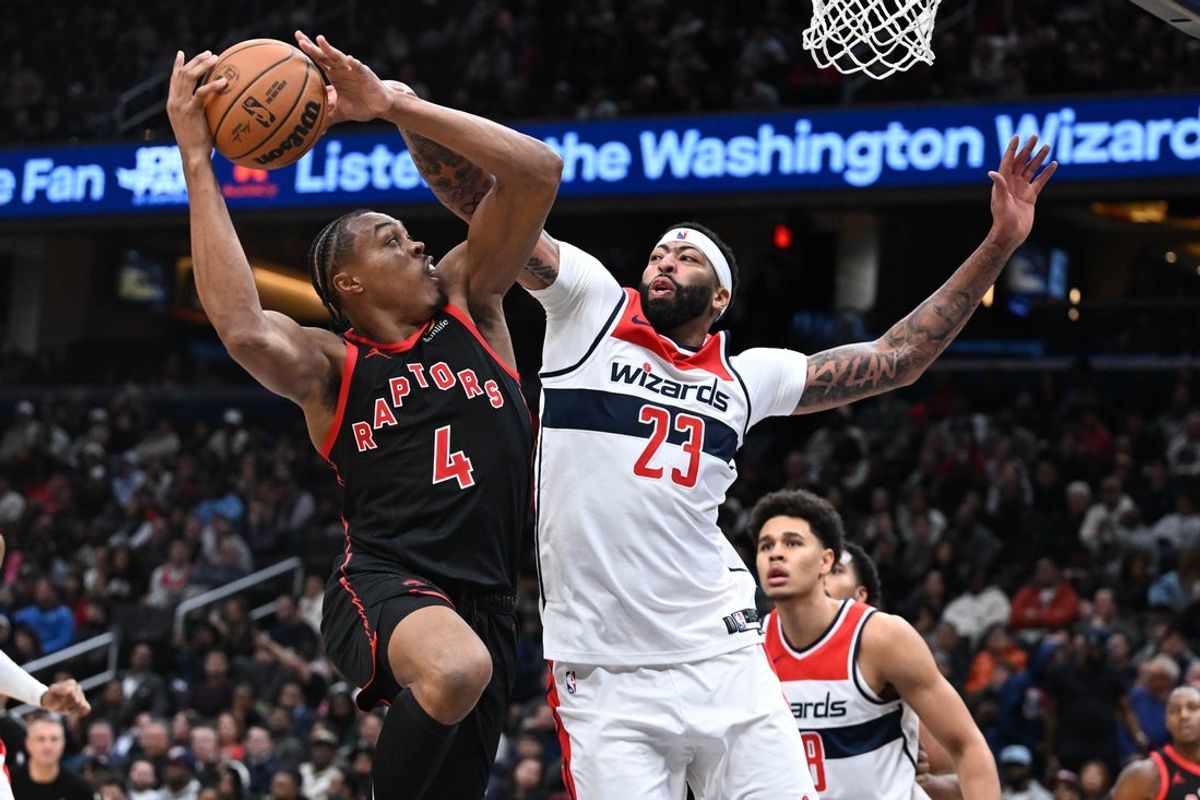 Oct 23, 2026; Washington, District of Columbia, USA; Toronto Raptors forward/guard Scottie Barnes (4) is fouled by Washington Wizards forward/center Anthony Davis (23) during the second half at Capital One Arena. Mandatory Credit: Brad Mills-Imagn Images