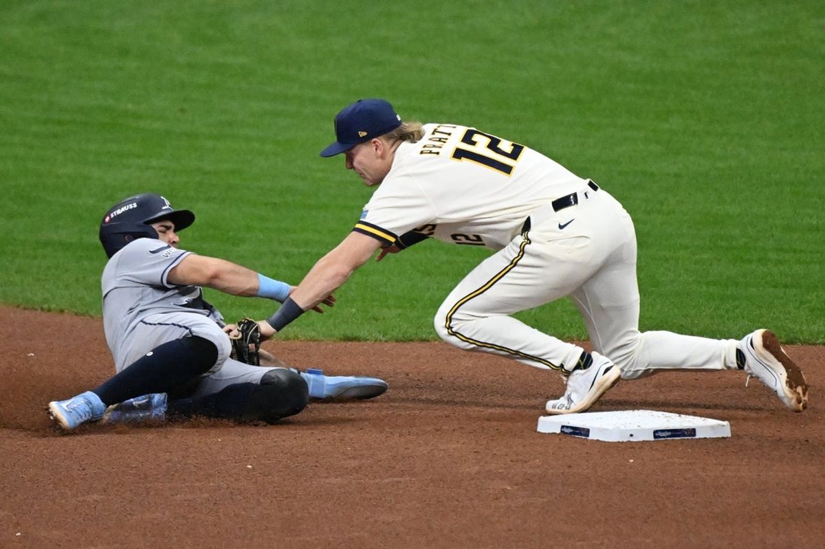 Oct 23, 2026; Milwaukee, Wisconsin, USA;  Milwaukee Brewers shortstop Cooper Pratt (12) tags out Tampa Bay Rays first baseman Jonathan Aranda (8) during the sixth inning in game one of the 2026 World Series at American Family Field.  Mandatory Credit: Matt Marton-Imagn Images
