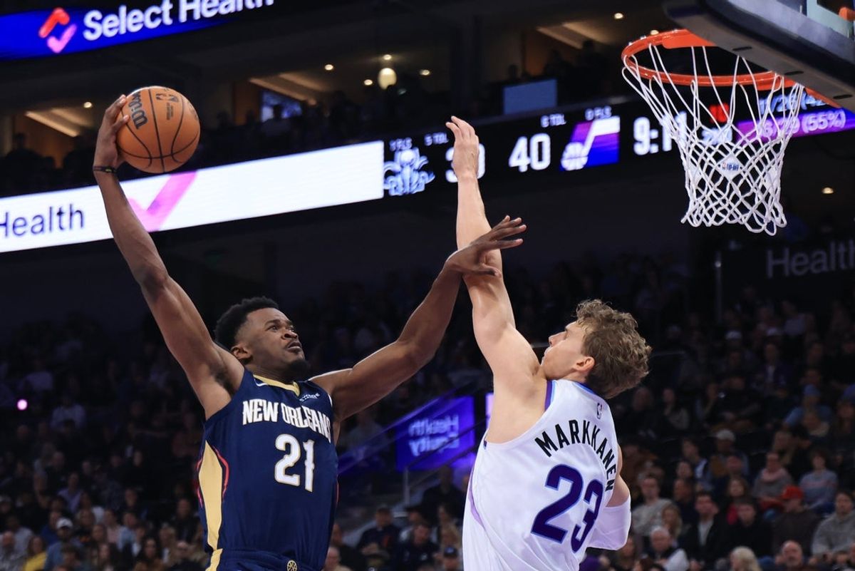 Oct 23, 2026; Salt Lake City, Utah, USA;  New Orleans Pelicans center Yves Missi (21) goes up for a shot against Utah Jazz forward Lauri Markkanen (23) during the first half at Delta Center.  Mandatory Credit: Rob Gray-Imagn Images