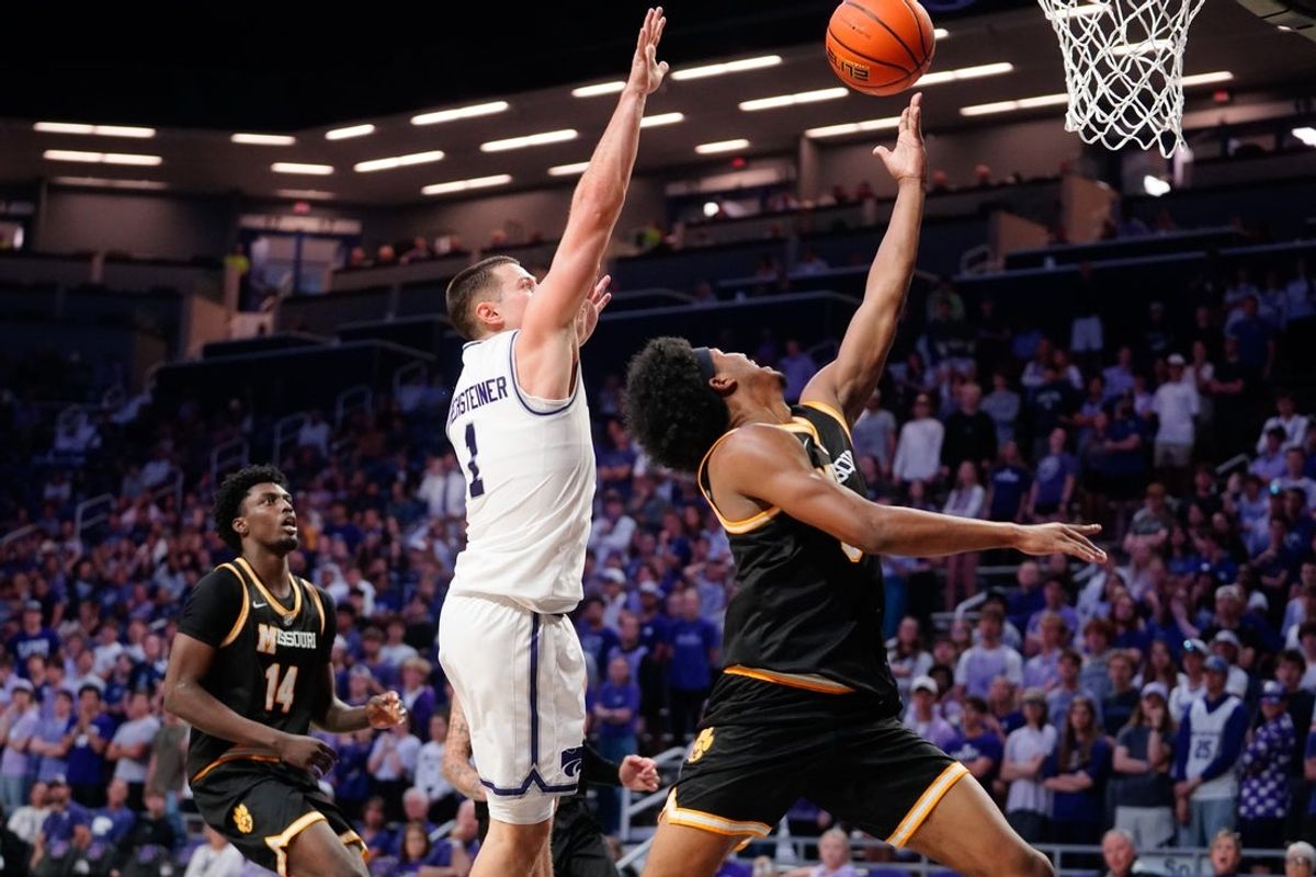 Missouri Tigers guard Jason Crowe Jr. (5) shoots the ball against Kansas State Wildcats guard Brandon Rechsteiner (1) during the exhibition game inside Bramlage Coliseum in Manhattan, Kansas on Oct. 23, 2026.