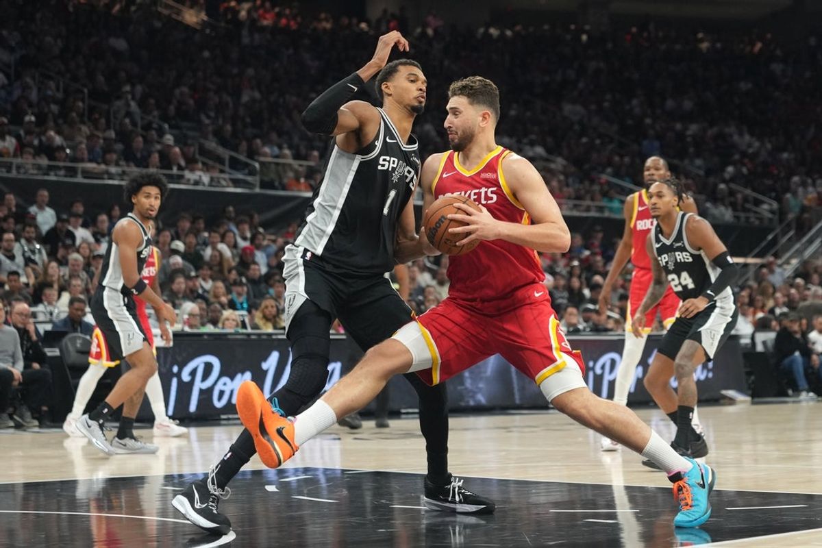 Oct 23, 2026; Austin, Texas, USA;  Houston Rockets center Alperen Sengun (28) drives to the basket against San Antonio Spurs forward Victor Wembanyama (1) during the first half at Moody Center.  Mandatory Credit: Scott Wachter-Imagn Images