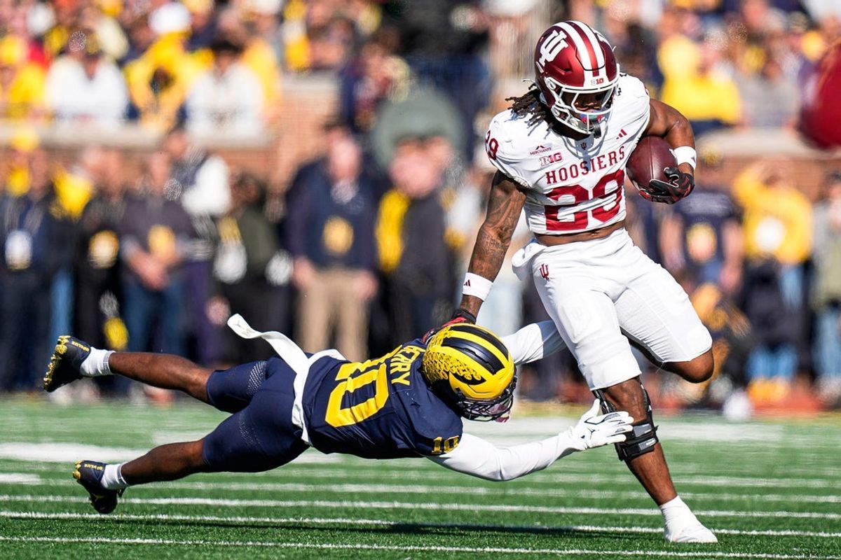 Indiana running back Lee Beebe Jr. (29) runs against Michigan cornerback Zeke Berry (10) during the first half at Michigan Stadium in Ann Arbor on Saturday, Oct. 24, 2026.
