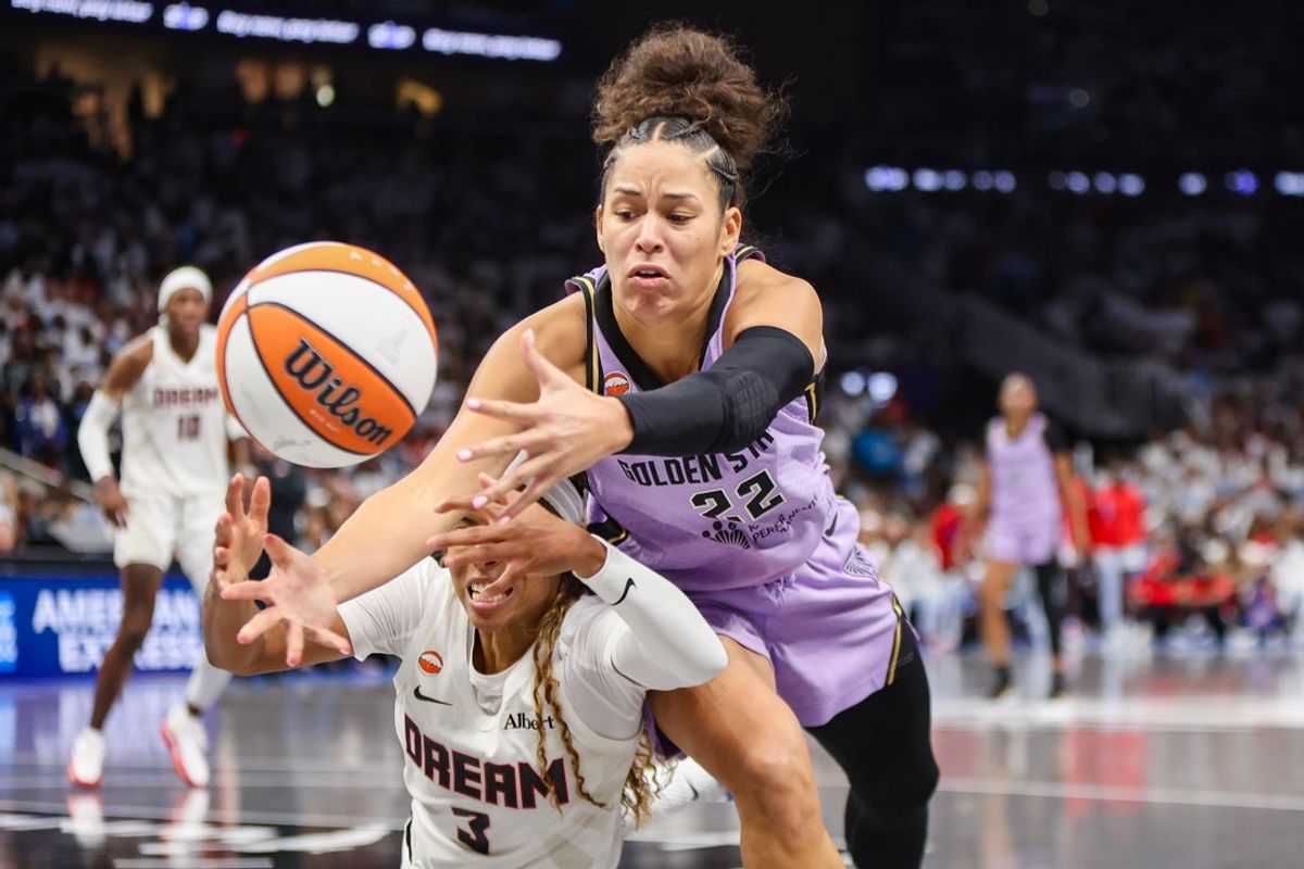 Golden State Valkyries guard Veronica Burton (22) and Atlanta Dream guard Jordin Canada (3) dive for a loose ball in the fourth quarter during game four of the 2026 WNBA Finals at State Farm Arena.