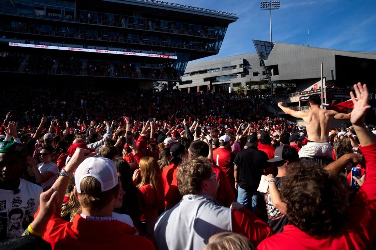 Cincinnati Bearcats fans charge the field after the Cincinnati Bearcats defeated Texas Tech Red Raiders at Nippert Stadium in Cincinnati on Saturday, October 24, 2026.