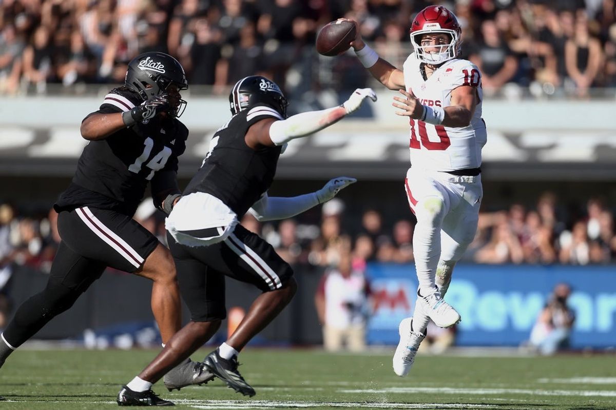 Oct 24, 2026; Starkville, Mississippi, USA;  Oklahoma Sooners quarterback John Mateer (10) passes the ball for a touchdown during the second quarter against the Mississippi State Bulldogs at Davis Wade Stadium at Scott Field.  Mandatory Credit: Petre Thomas-Imagn Images