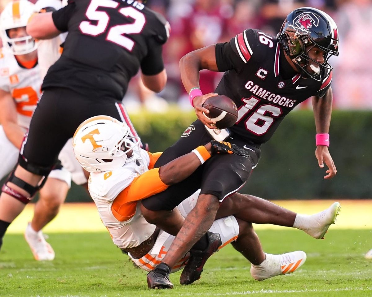 South Carolina quarterback LaNorris Sellers (16) escapes a tackle attempt by Tennessee defensive back Qua Moss (6) during a college football game between Tennessee and South Carolina at Williams-Brice Stadium in Columbia, S.C., on Oct. 24, 2026.