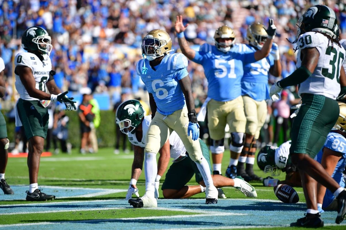 Oct 24, 2026; Pasadena, California, USA;  UCLA Bruins running back Anthony Woods (6) celebrates after a rushing touchdown during the second half against the Michigan State Spartans at Rose Bowl.  Mandatory Credit: Gary A. Vasquez-Imagn Images