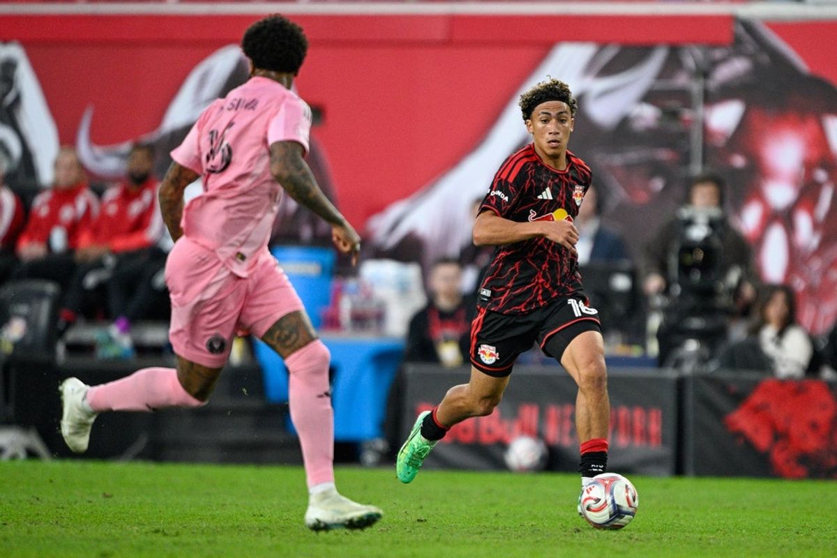 Oct 24, 2026; Harrison, New Jersey, USA;  Red Bull New York forward Julian Hall (16) runs with the ball defended by Inter Miami CF defender Micael Dos Santos (16) during the first half at Sports Illustrated Stadium.  Mandatory Credit: Mark Smith-Imagn Images
