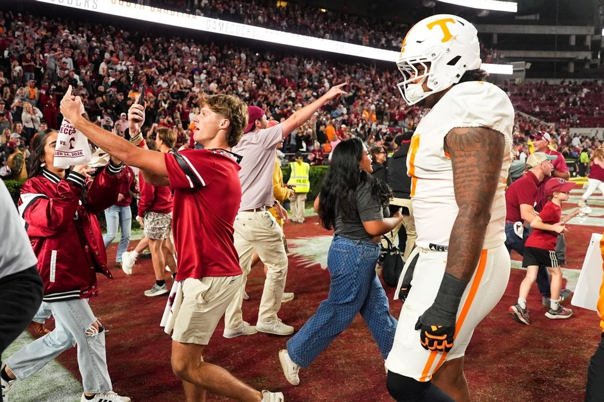 Tennessee defensive lineman Ethan Utley (17) walks off the field as South Carolina fans storm the field during a college football game between Tennessee and South Carolina at Williams-Brice Stadium in Columbia, S.C., on Oct. 24, 2026.