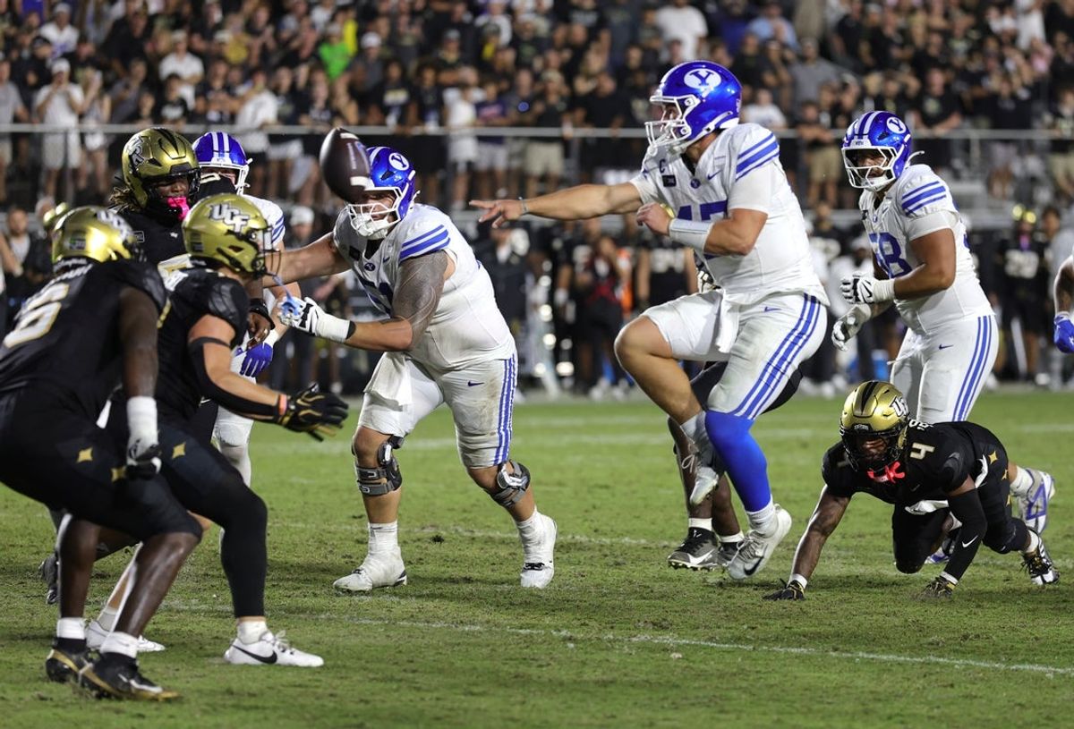 Brigham Young Cougars quarterback Bear Bachmeier (47) attempts a pass on third down neat the goal line against the Central Florida Knights during the second overtime at Acrisure Bounce House.