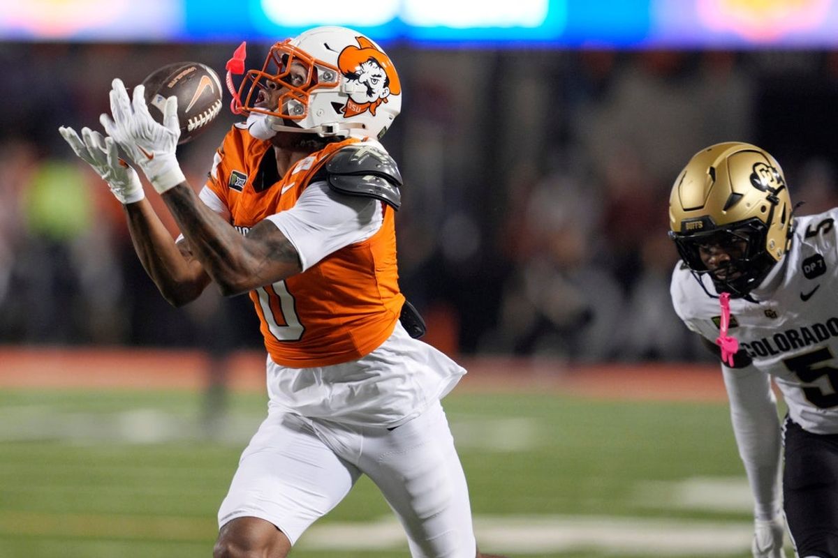 Oklahoma State Cowboys wide receiver Justin Bowick (0) catches the ball ion front of Colorado Buffaloes defensive back RJ Johnson (5) during a college football game between the Oklahoma State Cowboys (OSU) and the Colorado Buffaloes at Boone Pickens Stadium in Stillwater, Okla., Saturday, Oct. 24, 2026.