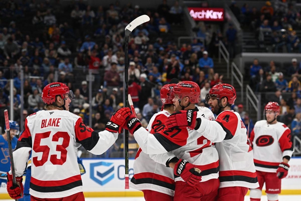 Oct 24, 2026; St. Louis, Missouri, USA;  Carolina Hurricanes left wing Nikolaj Ehlers (27) is congratulated after scoring against the St. Louis Blues in the third period at Enterprise Center.  Mandatory Credit: Joe Puetz-Imagn Images