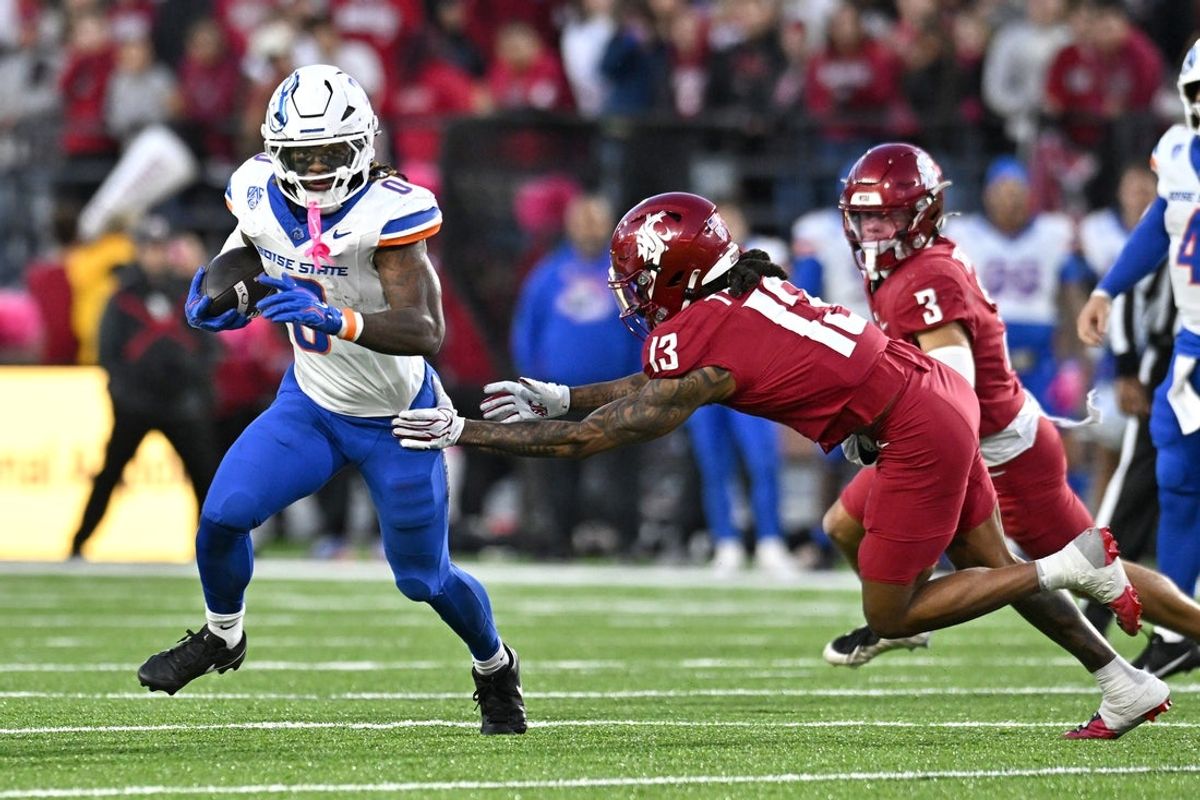 Boise State Broncos running back Dylan Riley (0) breaks the tackle of Washington State Cougars cornerback Khamari Terrell (13) during the second half at Gesa Field at Martin Stadium. Boise State Broncos won 31-10.