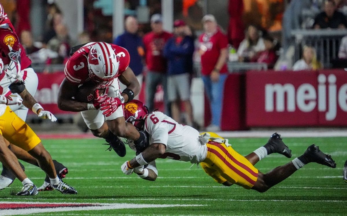 USC Trojans safety Christian Pierce (6) tackles Wisconsin Badgers running back Abu Sama III (3) during their game Oct. 24, 2026, at Camp Randall Stadium in Madison, Wisconsin.