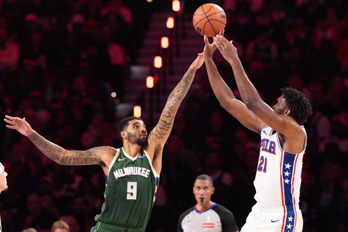 Oct 24, 2026; Philadelphia, Pennsylvania, USA; Philadelphia 76ers center Joel Embiid (21) shoots past Milwaukee Bucks center Kel'el Ware (9) during the third quarter at Xfinity Mobile Arena. Mandatory Credit: Bill Streicher-Imagn Images