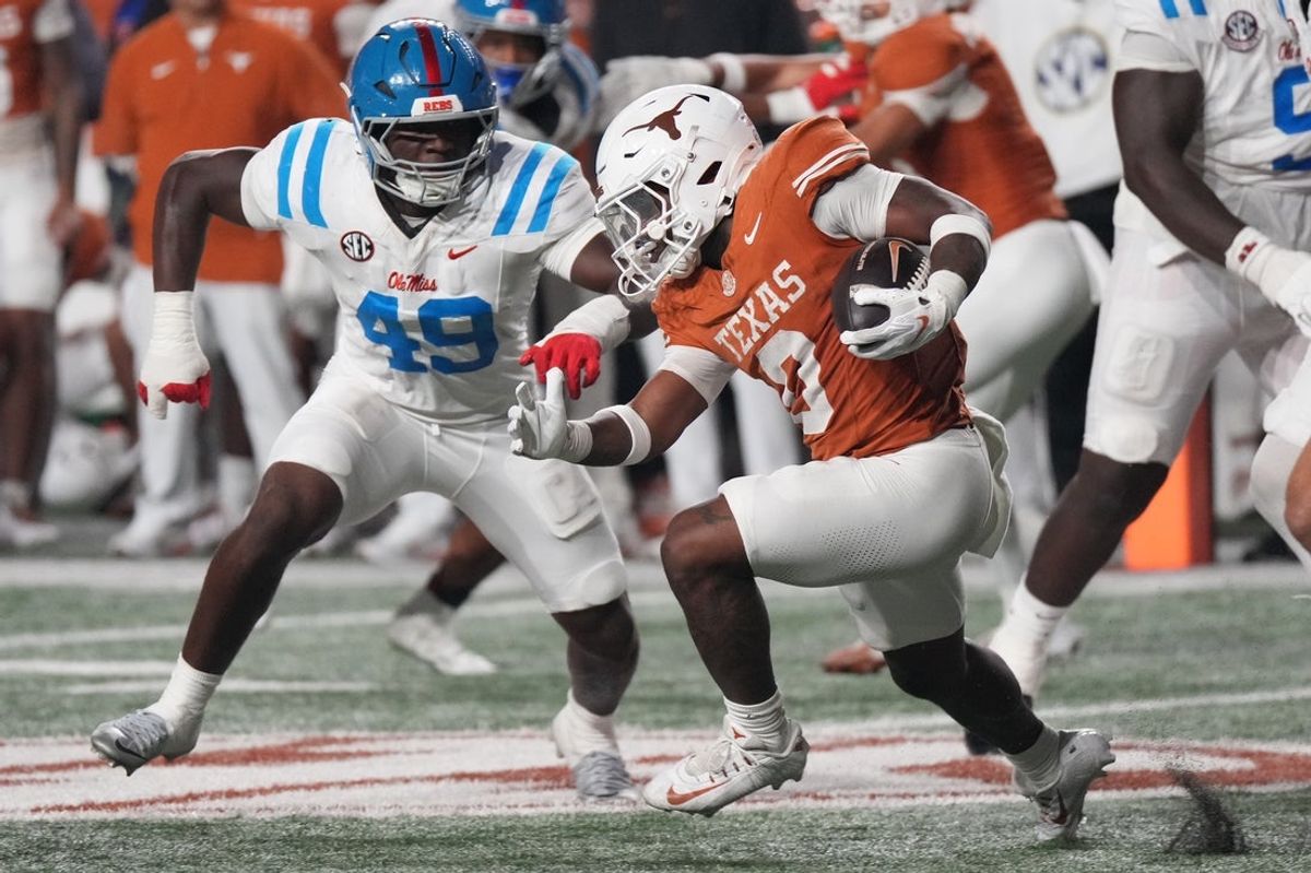Oct 24, 2026; Austin, Texas, USA;  Texas Longhorns running back Raleek Brown (0) carries the ball as Mississippi Rebels linebacker Tah'j Butler (49) tackles during the second half at Darrell K Royal-Texas Memorial Stadium.  Mandatory Credit: Scott Wachter-Imagn Images